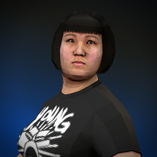 A young Chinese woman with close-cropped dark hair and a black t-shirt with a band logo.