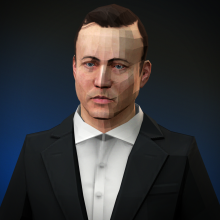 A man in a suit with the shirt buttoned to the neck, his hairline back tight off his forehead.